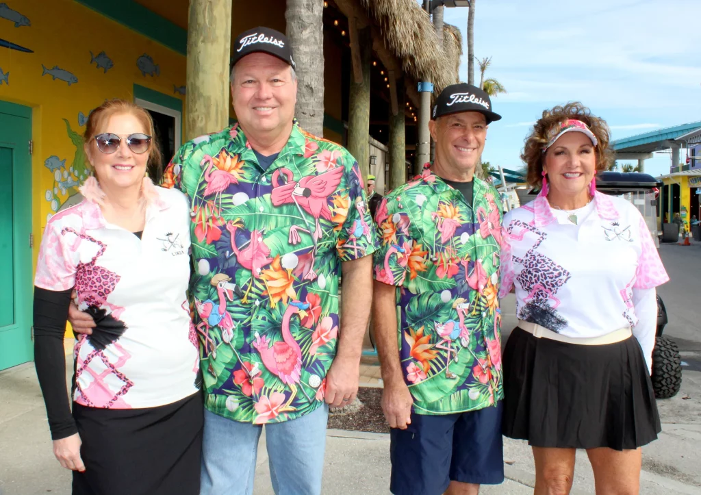two couples in flamingo outfits